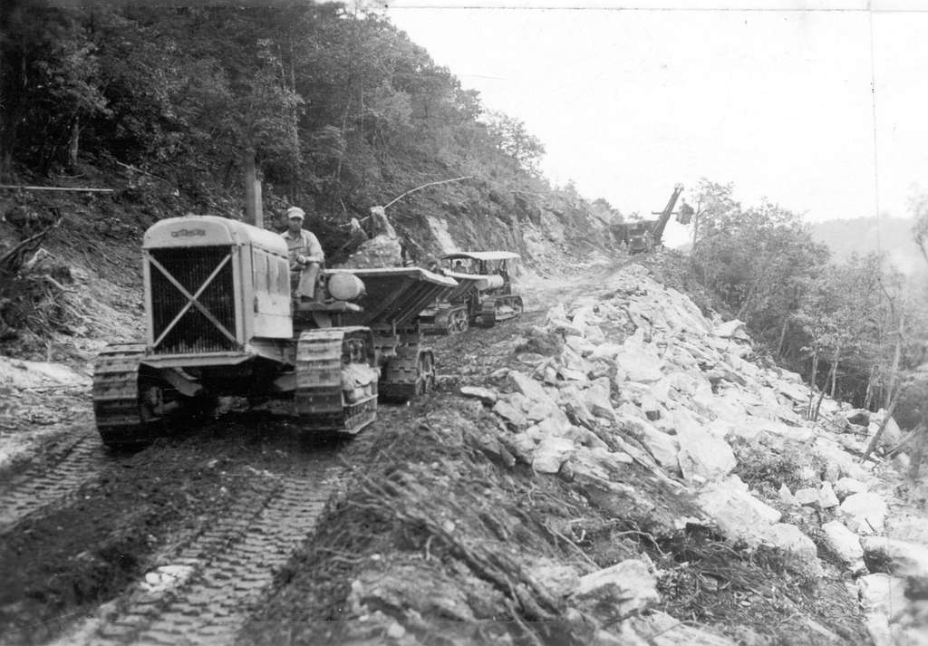 View looking south along the Parkway, showing cranes and tractors working near Mahogany Rock Parking Overlook at Milepost 235.2